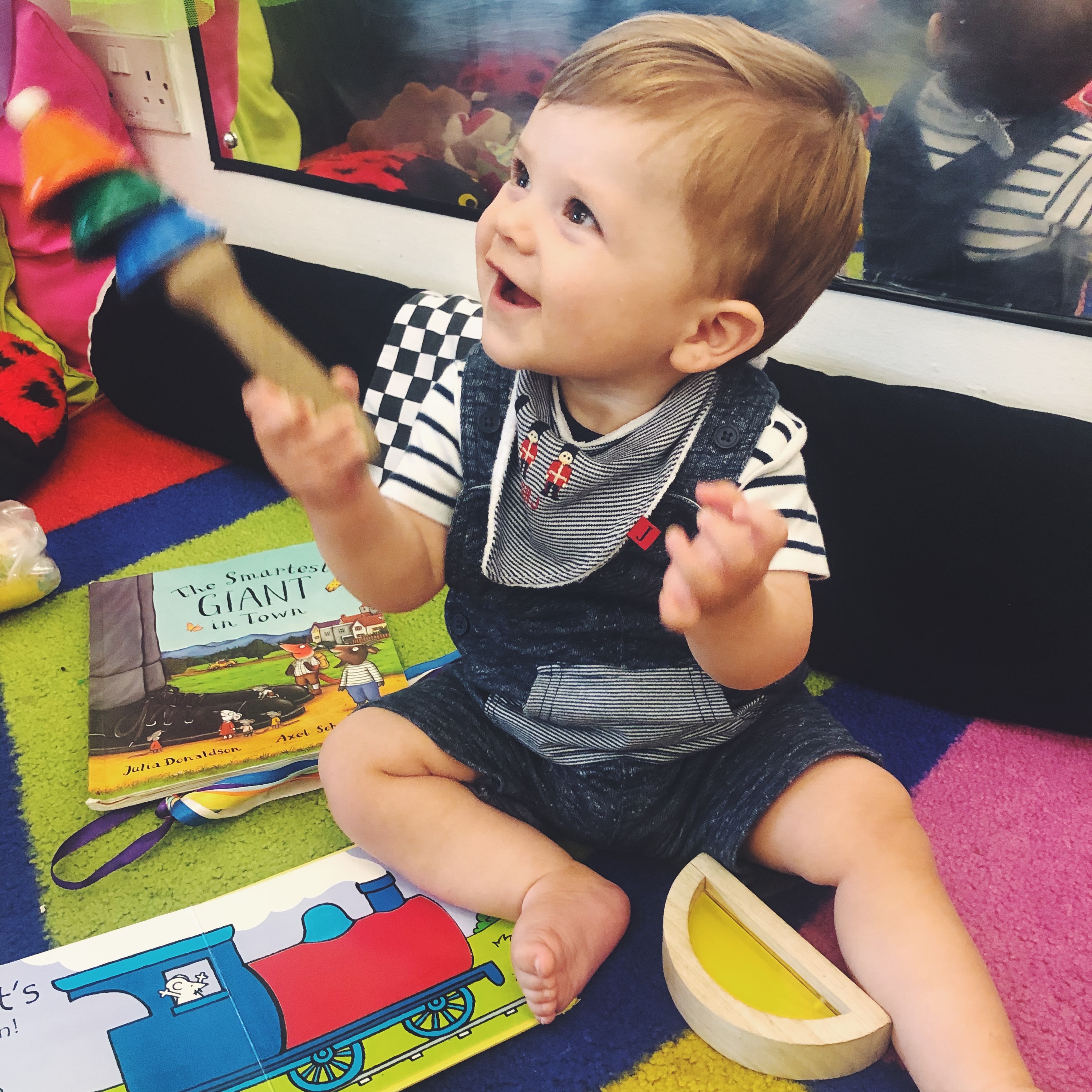 Baby boy playing musical instruments 