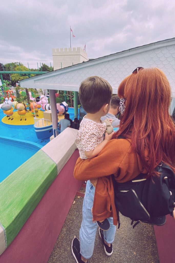 family day out at peppa pig world queuing 