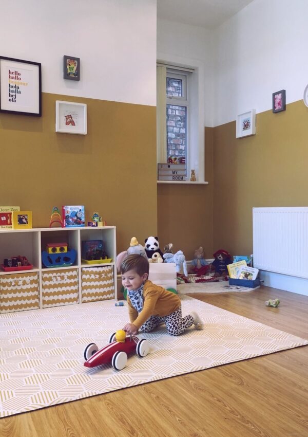 Playroom decorated yellow for a baby or toddler